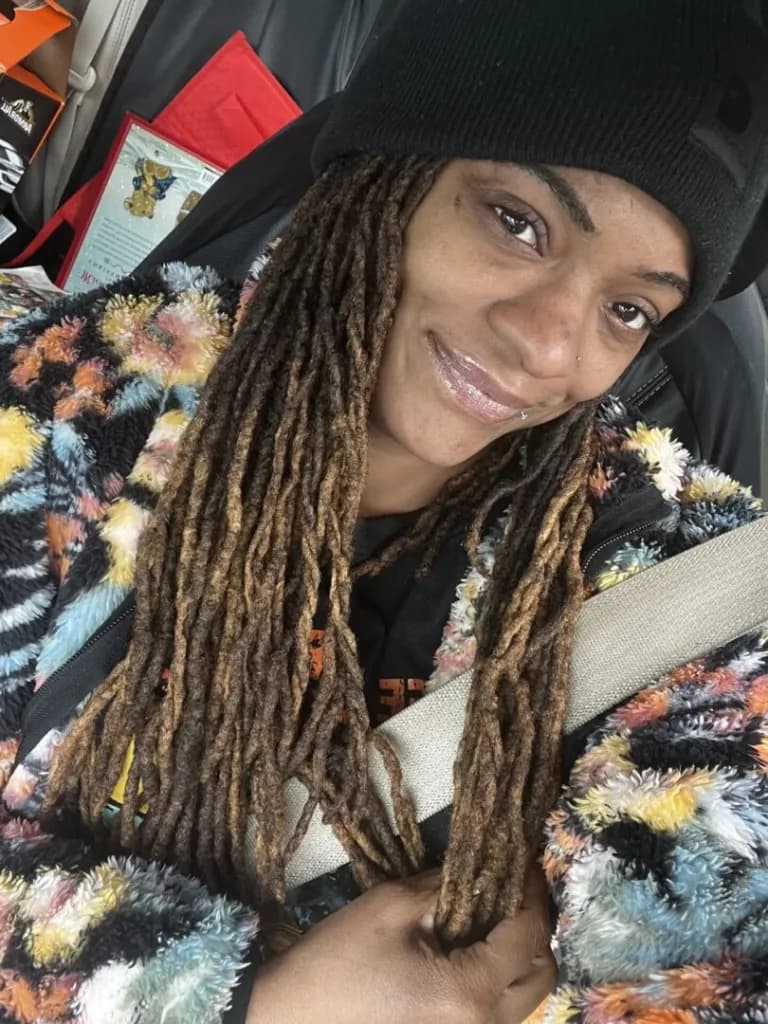 Parent smiling in Augusta community vehicle selfie